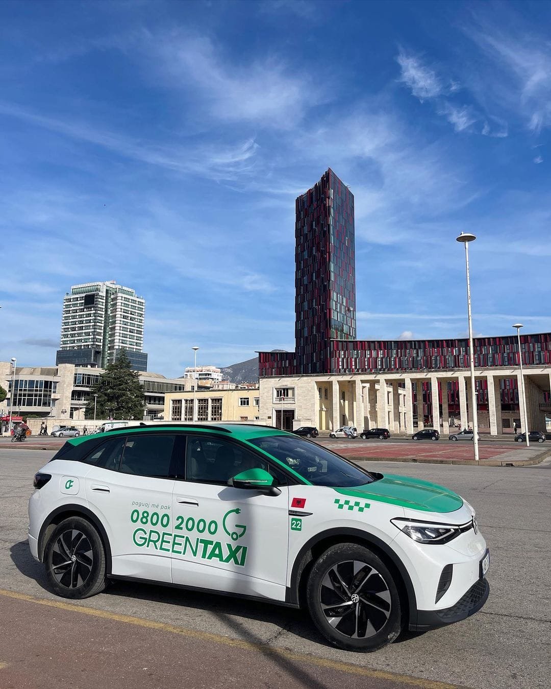 Green Taxi on road