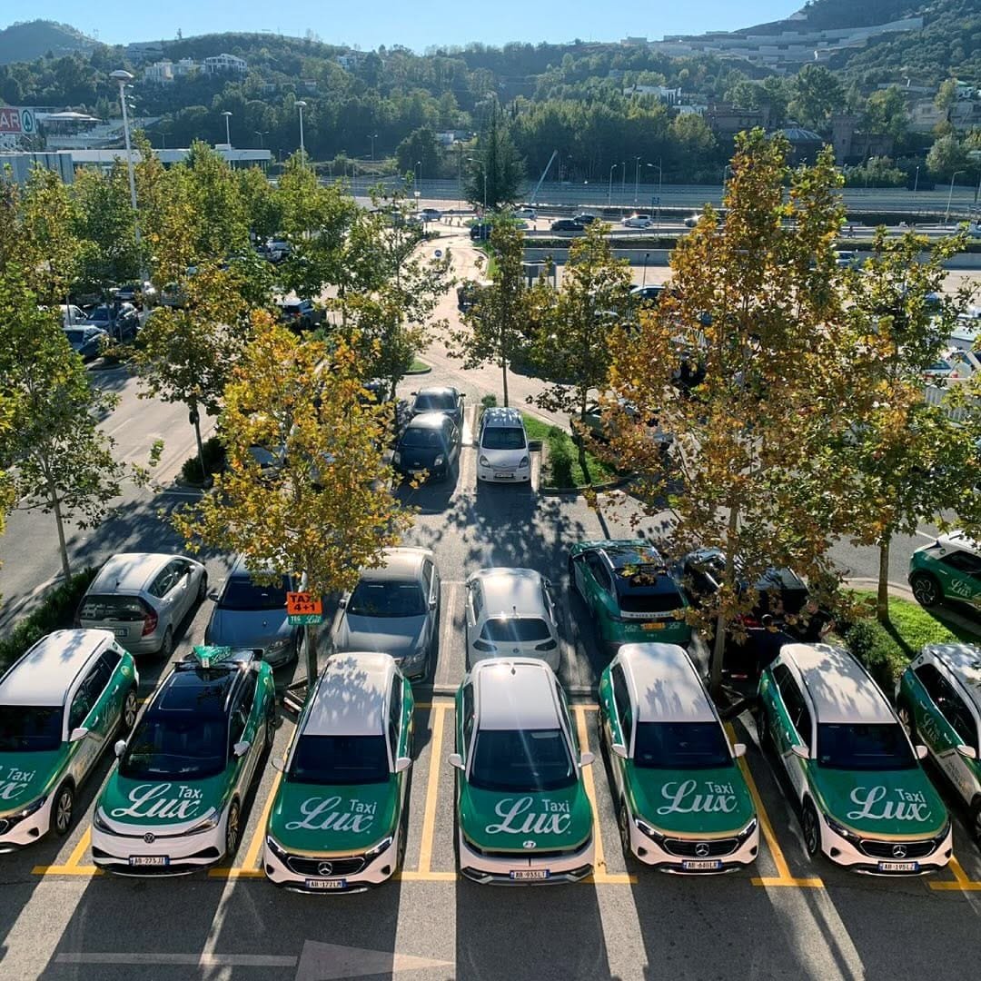 Taxi Lux parked in a parking spot