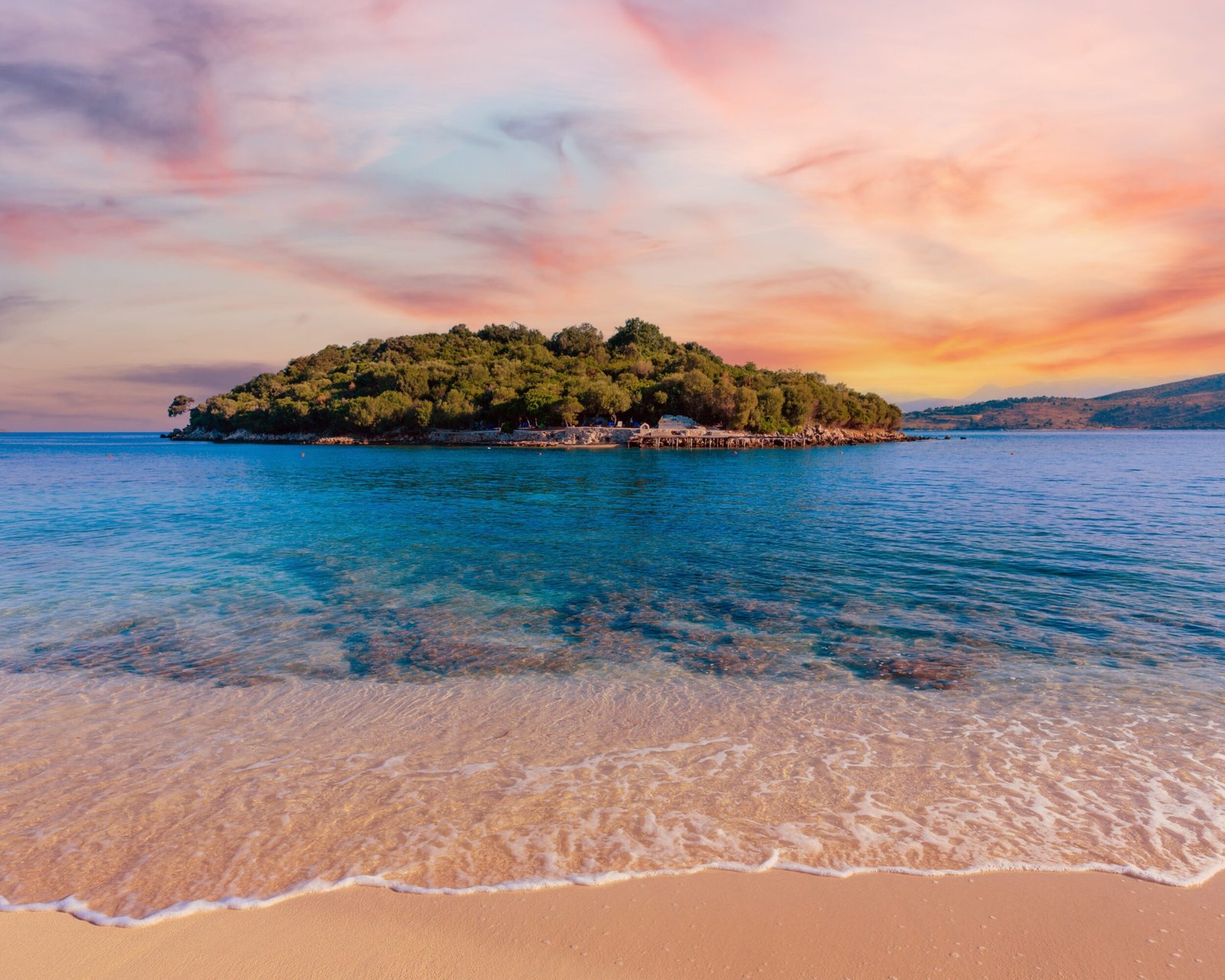 Soft white sand and turquoise water at Ksamil Beach